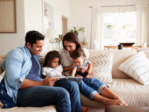 Reading time for a young family in an Evansville home.